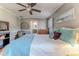 Main bedroom with wood floors and access to the bathroom at 2647 Royal Ridge Dr, Spring Hill, FL 34606