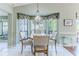 Charming breakfast nook with a round table and four chairs, adjacent to the kitchen at 2647 Royal Ridge Dr, Spring Hill, FL 34606