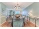 Spacious dining area with hardwood floors and view into the living room at 2647 Royal Ridge Dr, Spring Hill, FL 34606