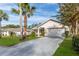 Single-story home with attached garage and lush landscaping at 2647 Royal Ridge Dr, Spring Hill, FL 34606