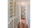 Charming hallway with unique wallpaper and wood flooring at 2647 Royal Ridge Dr, Spring Hill, FL 34606