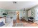 Spacious living room with hardwood floors and ample natural light at 2647 Royal Ridge Dr, Spring Hill, FL 34606