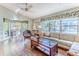 Spacious living room featuring hardwood floors and ample natural light at 2647 Royal Ridge Dr, Spring Hill, FL 34606
