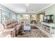 Relaxing living room with comfortable seating and view to kitchen at 2647 Royal Ridge Dr, Spring Hill, FL 34606