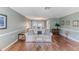 Living room with hardwood floors, and a view into dining area at 2647 Royal Ridge Dr, Spring Hill, FL 34606