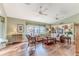 Spacious living room with built-in shelving, hardwood floors, and a cozy atmosphere at 2647 Royal Ridge Dr, Spring Hill, FL 34606