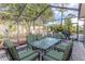Covered patio with table and chairs, overlooking lush landscaping at 2647 Royal Ridge Dr, Spring Hill, FL 34606