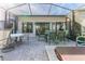 Outdoor patio with dining area and hot tub at 2647 Royal Ridge Dr, Spring Hill, FL 34606