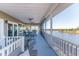 Enjoy water views from this screened balcony with multiple seating areas at 3217 Spanish Bayonet Dr, Hernando Beach, FL 34607