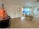 Small dining area with glass-top table and four chairs near the entryway at 3322 Fairmount Dr, Holiday, FL 34691