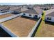 Aerial view of home with a large backyard and white fence at 3337 Autumn Amber Dr, Spring Hill, FL 34609