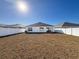 Large backyard with a white vinyl fence at 3337 Autumn Amber Dr, Spring Hill, FL 34609