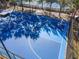 Basketball court with hoop and surrounding trees at 3337 Autumn Amber Dr, Spring Hill, FL 34609