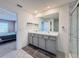 Double vanity bathroom with marble shower and access to bedroom at 3337 Autumn Amber Dr, Spring Hill, FL 34609