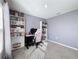 Bright bedroom with large window, built-in shelves and a pink desk at 3337 Autumn Amber Dr, Spring Hill, FL 34609