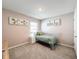 Cozy bedroom with a twin bed, window, and neutral decor at 3337 Autumn Amber Dr, Spring Hill, FL 34609