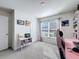 Spacious bedroom with large window, carpeted floor, and built-in shelves at 3337 Autumn Amber Dr, Spring Hill, FL 34609