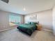 Spacious bedroom with green bedding and large window at 3337 Autumn Amber Dr, Spring Hill, FL 34609