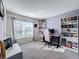 Bedroom with large window, built-in shelves, and gaming setup at 3337 Autumn Amber Dr, Spring Hill, FL 34609