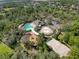 Aerial view showing community pool, playground, and sports courts at 3337 Autumn Amber Dr, Spring Hill, FL 34609