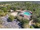 Aerial view of community pool, clubhouse, and playground at 3337 Autumn Amber Dr, Spring Hill, FL 34609