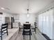 Bright dining area with wood-look floors and modern lighting at 3337 Autumn Amber Dr, Spring Hill, FL 34609