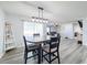 Dining area with table and chairs, open to the living room at 3337 Autumn Amber Dr, Spring Hill, FL 34609