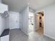 Bright entryway with tile flooring, bench, and access to other rooms at 3337 Autumn Amber Dr, Spring Hill, FL 34609