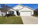 Inviting single-Gathering home with a neat front yard and a convenient two-car garage at 3337 Autumn Amber Dr, Spring Hill, FL 34609