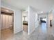 Hallway with tile flooring, doors to bedrooms and bathroom at 3337 Autumn Amber Dr, Spring Hill, FL 34609