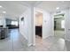 Hallway view with laundry room, living room, and another room at 3337 Autumn Amber Dr, Spring Hill, FL 34609