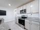 Modern kitchen with stainless steel appliances and granite countertops at 3337 Autumn Amber Dr, Spring Hill, FL 34609