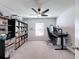 Home office with large desk, bookcase, and ceiling fan at 3337 Autumn Amber Dr, Spring Hill, FL 34609