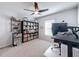 Home office with large desk, bookcase, and ceiling fan at 3337 Autumn Amber Dr, Spring Hill, FL 34609