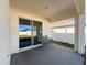 Covered patio with sliding glass doors and bench at 3337 Autumn Amber Dr, Spring Hill, FL 34609