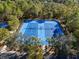 Aerial view of two well-maintained tennis courts at 3337 Autumn Amber Dr, Spring Hill, FL 34609