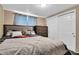 Spacious bedroom with comfortable bed, closet space, and serene atmosphere at 3337 Darlington Rd, Holiday, FL 34691