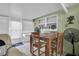 Cozy dining area features a wooden table with chairs and natural light from the windows at 3337 Darlington Rd, Holiday, FL 34691