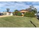 Charming single-story home with a well-manicured lawn and mature landscaping in a quiet neighborhood at 3337 Darlington Rd, Holiday, FL 34691