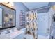 Main bathroom with shower/tub combo and vanity at 3714 Trophy Blvd # 3714, New Port Richey, FL 34655