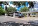 Carport and home exterior with lush landscaping at 3714 Trophy Blvd # 3714, New Port Richey, FL 34655