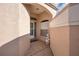 Front entry with arched entryway, tiled floor, and decorative statue at 390 Royal Palm Way, Spring Hill, FL 34608