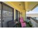 Private balcony with seating, plants, and partial view at 455 Alt 19 S # 163, Palm Harbor, FL 34683