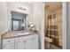 Clean bathroom with a vanity, toilet, and shower/tub combo at 455 Alt 19 S # 163, Palm Harbor, FL 34683