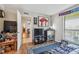 Bedroom with a TV, futon, and view into another room at 455 Alt 19 S # 163, Palm Harbor, FL 34683