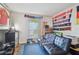 Multipurpose bedroom with a futon, window, and sports memorabilia at 455 Alt 19 S # 163, Palm Harbor, FL 34683