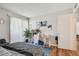 Comfortable bedroom with a private door and hardwood floors at 455 Alt 19 S # 163, Palm Harbor, FL 34683