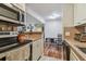 Open concept kitchen with breakfast bar and view to dining area at 455 Alt 19 S # 163, Palm Harbor, FL 34683