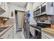 Clean and efficient kitchen with stainless steel appliances at 455 Alt 19 S # 163, Palm Harbor, FL 34683