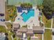 L-Shaped pool with spa, and plenty of lounge chairs at 455 Alt 19 S # 163, Palm Harbor, FL 34683